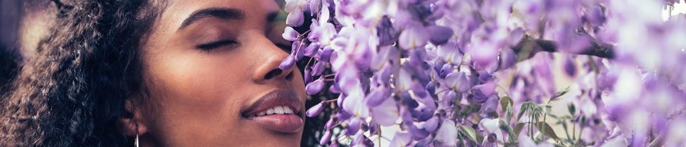 black woman smelling lavender