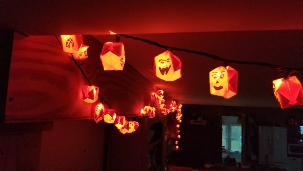 Halloween holiday tradition orange origami ball string lights (jack-o-lanterns)